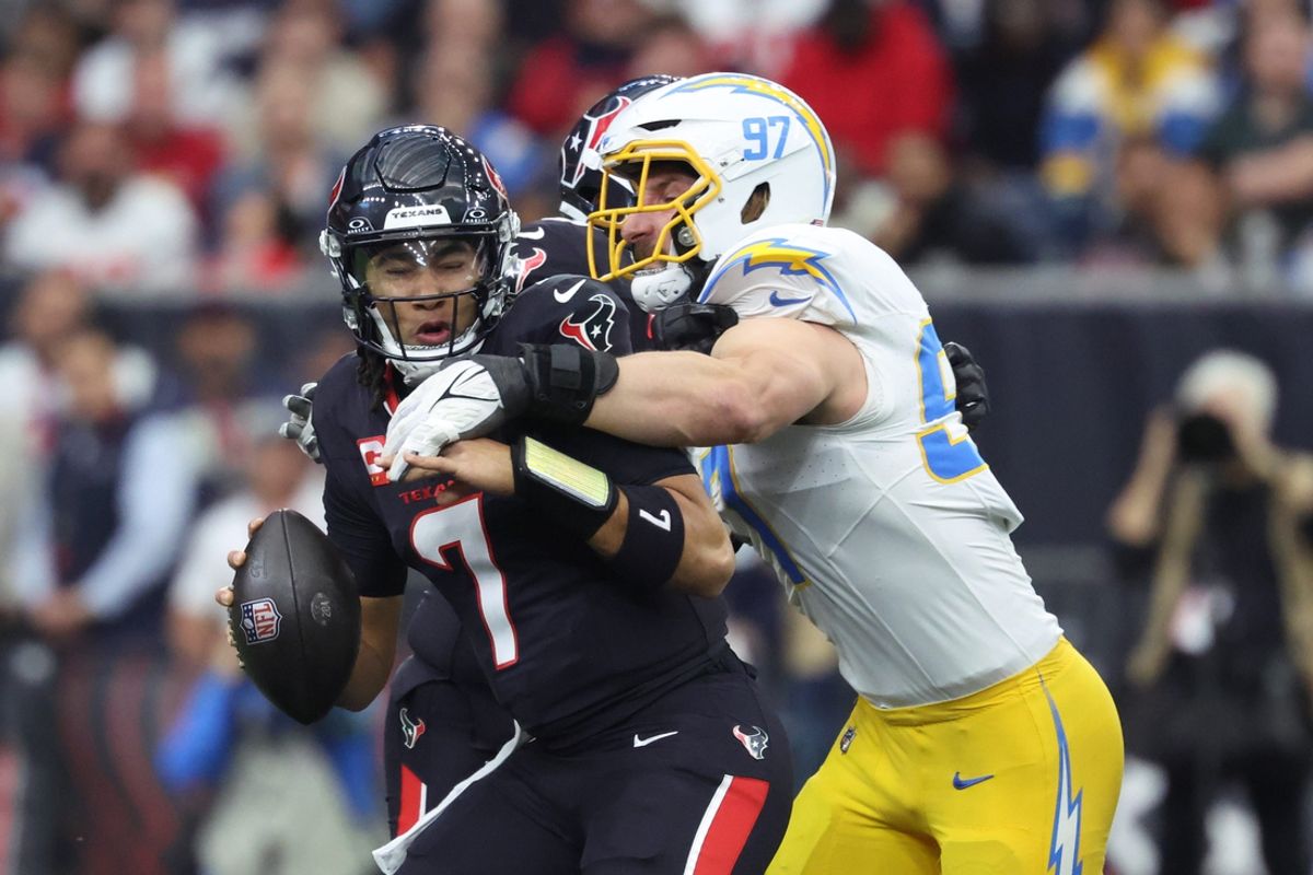 Jan 11, 2025; Houston, Texas, USA; Los Angeles Chargers outside linebacker Joey Bosa (97) sacks Houston Texans quarterback C.J. Stroud (7) during the first quarter in an AFC wild card game at NRG Stadium. Mandatory Credit: Troy Taormina-Imagn Images