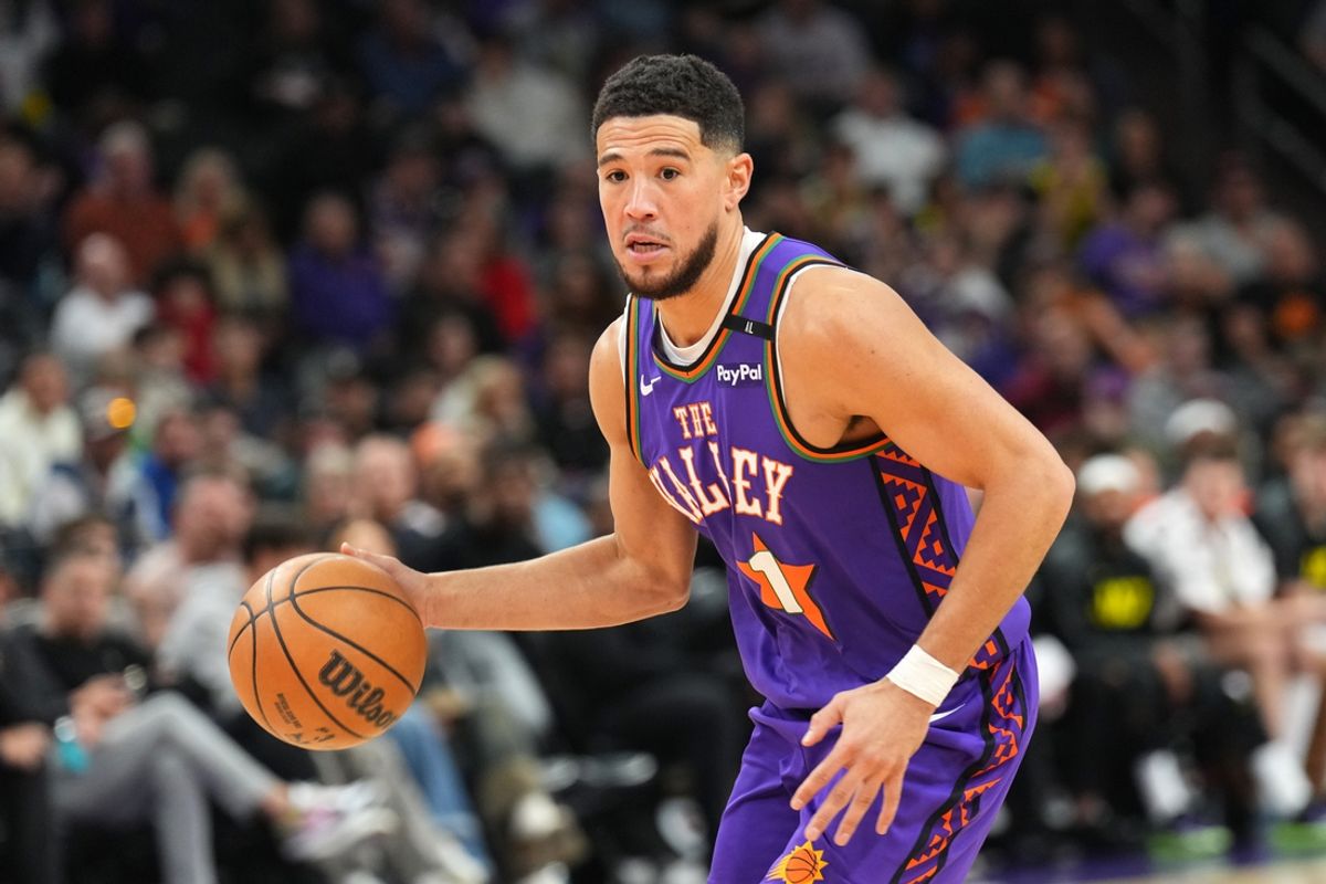 Jan 11, 2025; Phoenix, Arizona, USA; Phoenix Suns guard Devin Booker (1) dribbles against the Utah Jazz during the second half at Footprint Center. Mandatory Credit: Joe Camporeale-Imagn Images