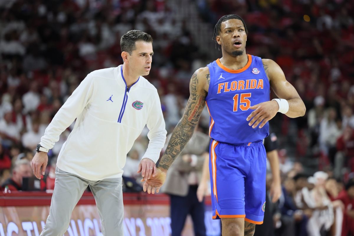 Jan 11, 2025; Fayetteville, Arkansas, USA; Florida Gators head coach Todd Golden talks to guard Alijah Martin (15) during the second half against the Arkansas Razorbacks at Bud Walton Arena. Mandatory Credit: Nelson Chenault-Imagn Images