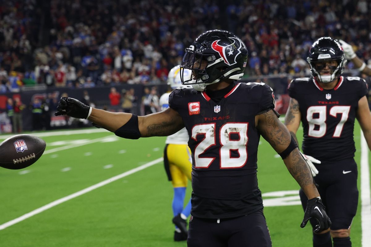 Jan 11, 2025; Houston, Texas, USA;  Houston Texans running back Joe Mixon (28) reacts to his rushing first down against the Los Angeles Chargers in the fourth quarter in an AFC wild card game at NRG Stadium. Mandatory Credit: Thomas Shea-Imagn Images