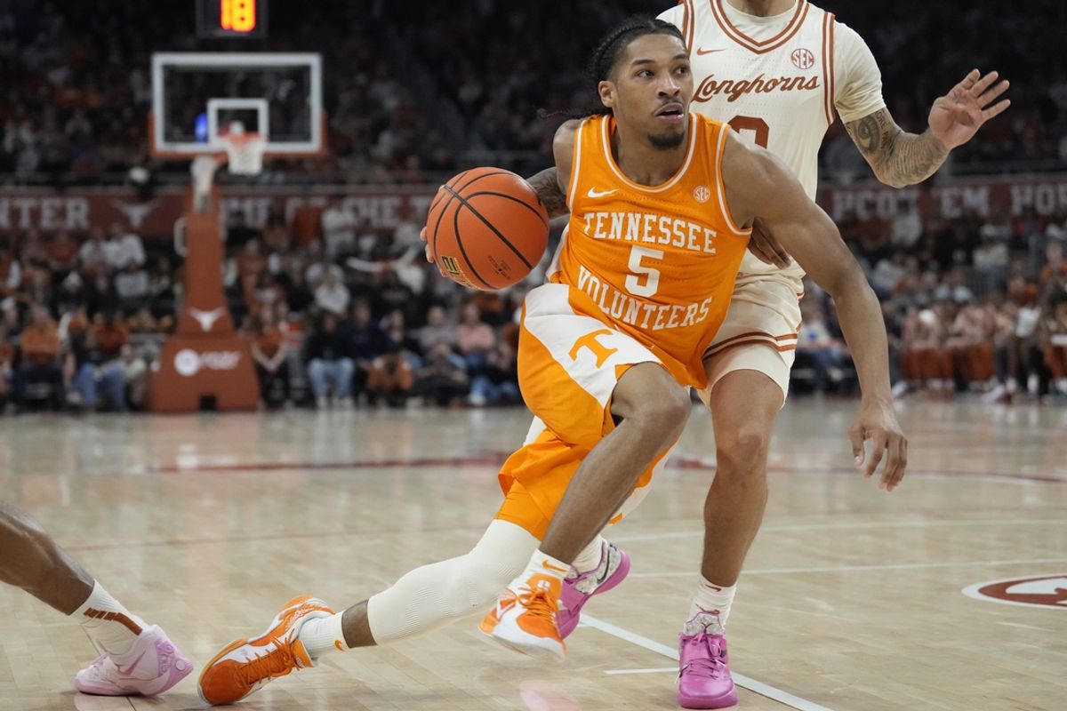 Jan 11, 2025; Austin, Texas, USA; Tennessee Volunteers guard Zakai Zeigler (5) drives to the basket during the second half against the Texas Longhorns at Moody Center. Mandatory Credit: Scott Wachter-Imagn Images
