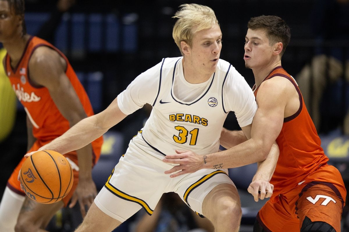 Jan 11, 2025; Berkeley, California, USA; (Editors Notes: Caption Correction) California Golden Bears forward Rytis Petraitis (31) controls the ball against Virginia Tech Hokies guard Brandon Rechsteiner (right) during the first half at Haas Pavilion. Mandatory Credit: D. Ross Cameron-Imagn Images