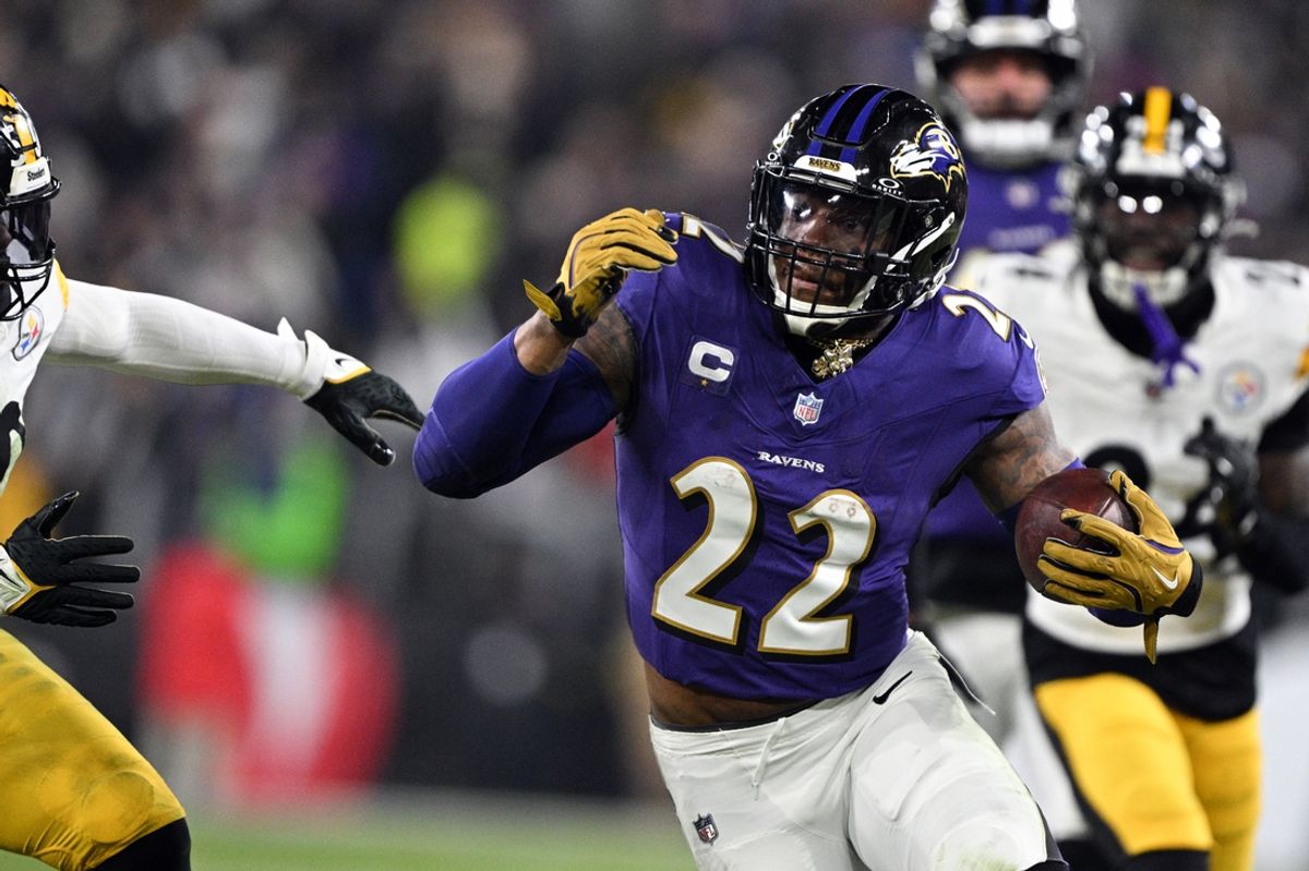 Jan 11, 2025; Baltimore, Maryland, USA; Baltimore Ravens running back Derrick Henry (22) runs against Pittsburgh Steelers linebacker Elandon Roberts (50) in the second quarter in an AFC wild card game at M&T Bank Stadium. Mandatory Credit: Tommy Gilligan-Imagn Images