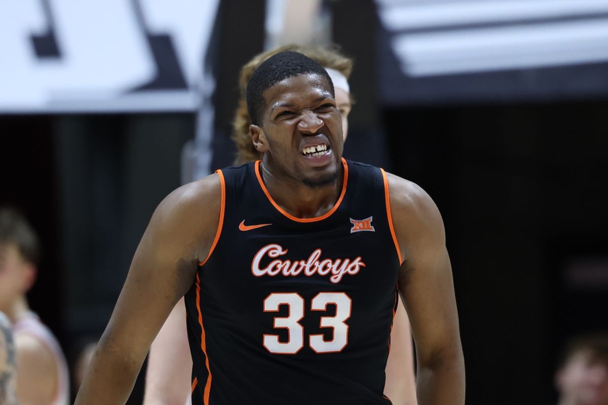 Jan 11, 2025; Salt Lake City, Utah, USA; Oklahoma State Cowboys forward Abou Ousmane (33) reacts to a play against the Utah Utes during the second half at Jon M. Huntsman Center. Mandatory Credit: Rob Gray-Imagn Images