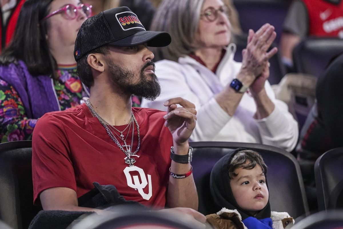 Jan 11, 2025; Athens, Georgia, USA; Atlanta Hawks player Trae Young with his son Tydus watch the game between the Georgia Bulldogs and the Oklahoma Sooners at Stegeman Coliseum. Mandatory Credit: Dale Zanine-Imagn Images