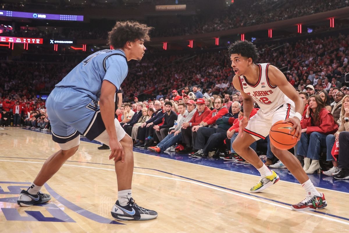 Jan 11, 2025; New York, New York, USA;  St. John's Red Storm guard RJ Luis Jr. (12) controls the ball against Villanova Wildcats guard Tyler Perkins (4) in the second half at Madison Square Garden. Mandatory Credit: Wendell Cruz-Imagn Images