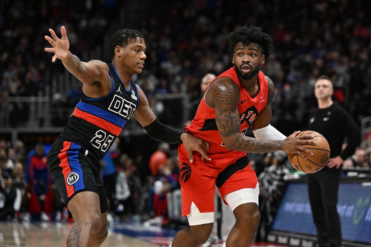 Jan 11, 2025; Detroit, Michigan, USA;  Toronto Raptors guard Jamal Shead (23) looks to pass the ball while being guarded by Detroit Pistons guard Marcus Sasser (25) in the fourth quarter at Little Caesars Arena. Mandatory Credit: Lon Horwedel-Imagn Images