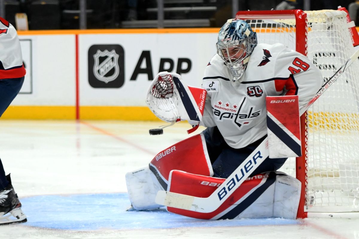 Jan 11, 2025; Nashville, Tennessee, USA;  Washington Capitals goaltender Logan Thompson (48) blocks the puck against the Nashville Predators during the third period at Bridgestone Arena. Mandatory Credit: Steve Roberts-Imagn Images