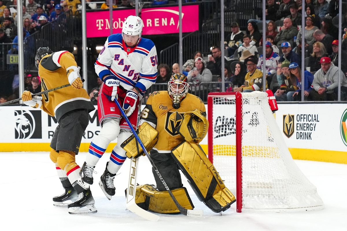 Jan 11, 2025; Las Vegas, Nevada, USA; Vegas Golden Knights goaltender Adin Hill (33) makes a save as New York Rangers left wing Will Cuylle (50) looks for a rebound during the first period at T-Mobile Arena. Mandatory Credit: Stephen R. Sylvanie-Imagn Images