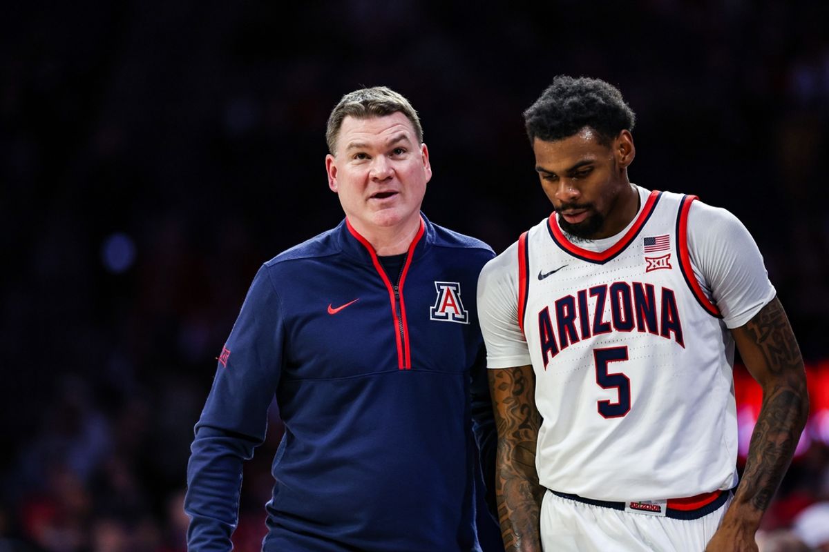 Jan 11, 2025; Tucson, Arizona, USA; Arizona Wildcats head coach Tommy Lloyd talks with guard KJ Lewis (5) during the first half against the UCF Knights at McKale Center. Mandatory Credit: Aryanna Frank-Imagn Images
