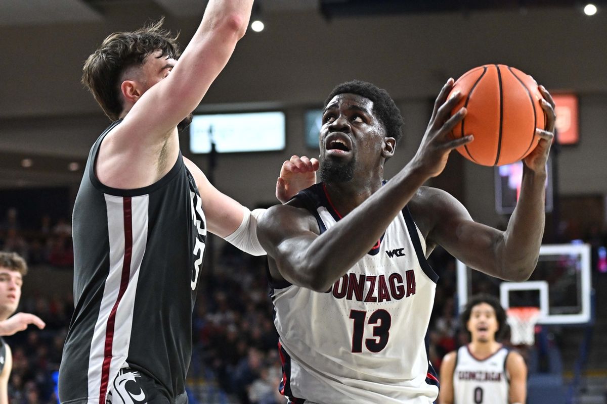 Jan 11, 2025; Spokane, Washington, USA; Gonzaga Bulldogs forward Graham Ike (13) shoots the ball against Washington State Cougars forward Ethan Price (3) in the second half at McCarthey Athletic Center. Mandatory Credit: James Snook-Imagn Images