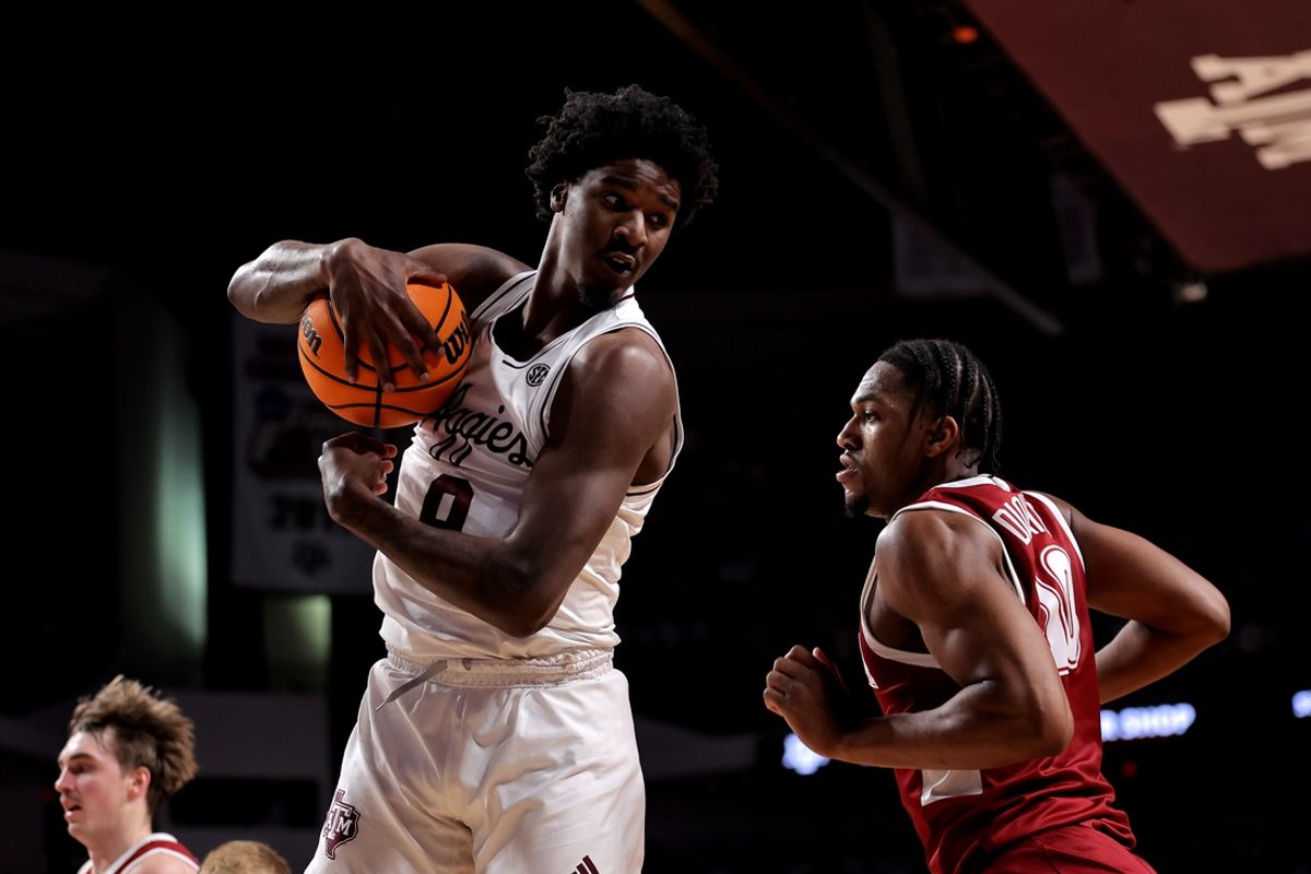 Jan 11, 2025; College Station, Texas, USA; Texas A&M Aggies forward Solomon Washington (9) rebounds against the Alabama Crimson Tide during the second half at Reed Arena. Mandatory Credit: Erik Williams-Imagn Images