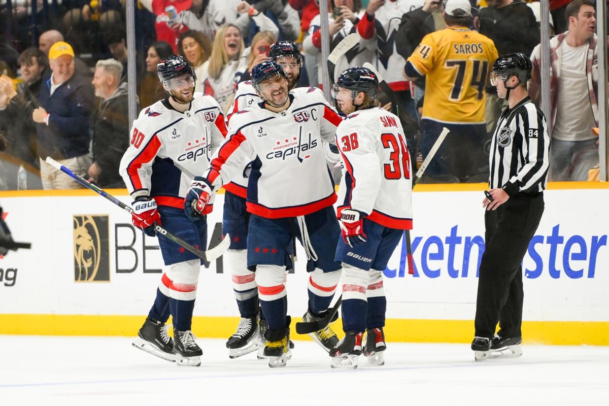 Jan 11, 2025; Nashville, Tennessee, USA;  Washington Capitals left wing Alex Ovechkin (8) celebrates with teammates after scoring a goal against the Nashville Predators during the third period at Bridgestone Arena. Mandatory Credit: Steve Roberts-Imagn Images