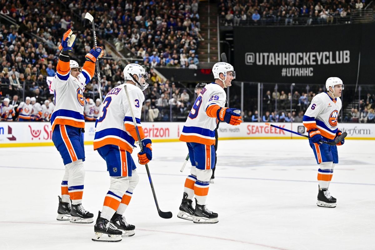 Jan 11, 2025; Salt Lake City, Utah, USA; New York Islanders left wing Anders Lee (27) celebrates with defenseman Adam Pelech (3), center Brock Nelson (29), and defenseman Ryan Pulock (6) after a goal against the Utah Hockey Club during third period at the Delta Center. Mandatory Credit: Christopher Creveling-Imagn Images