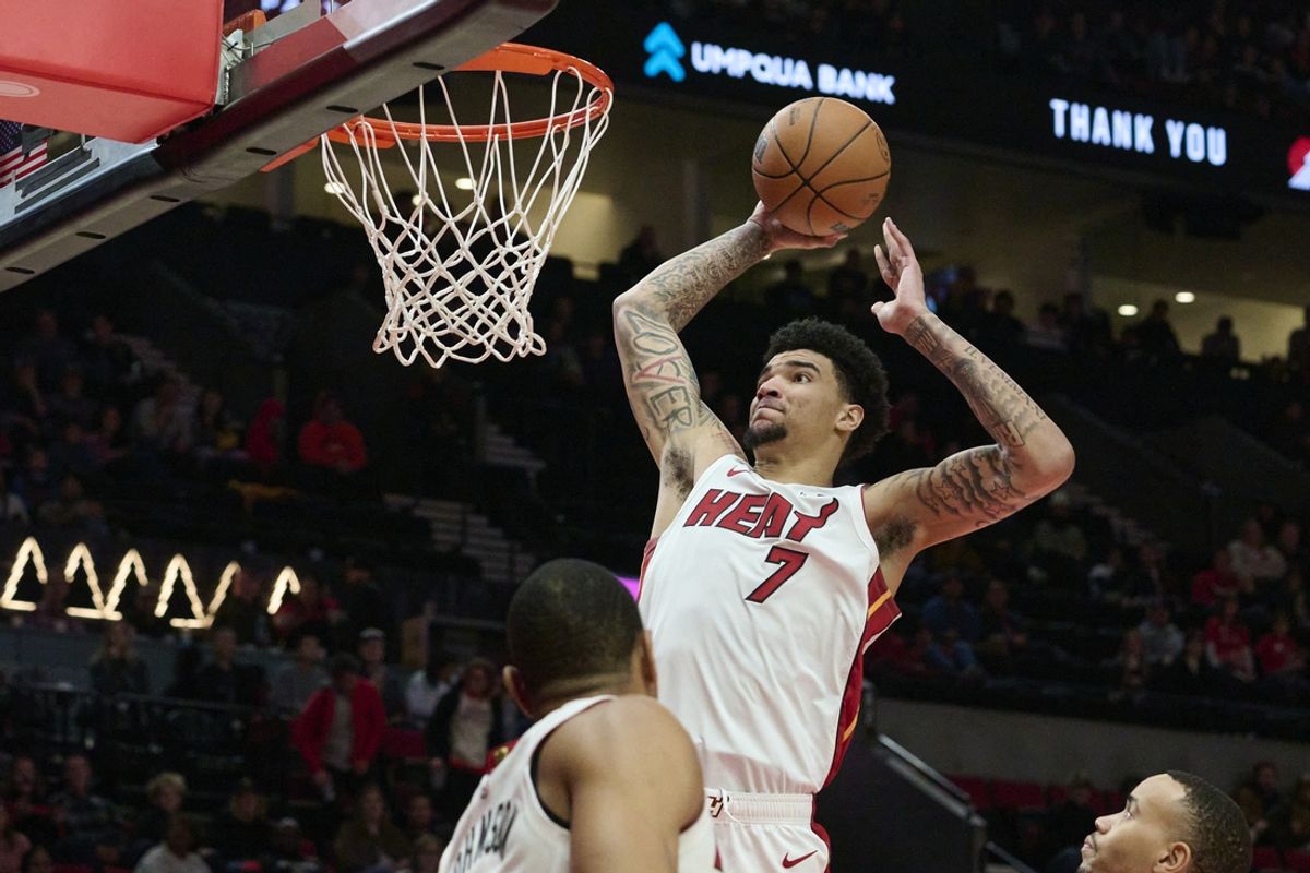 Jan 11, 2025; Portland, Oregon, USA; Miami Heat center Kel'el Ware (7) dunks the basketball during the second half against the Portland Trail Blazers at Moda Center. Mandatory Credit: Troy Wayrynen-Imagn Images