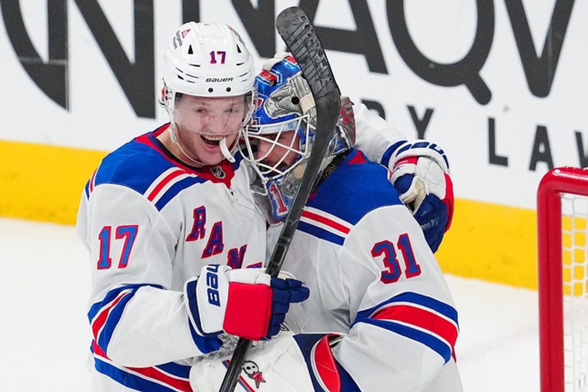 Jan 11, 2025; Las Vegas, Nevada, USA; New York Rangers goaltender Igor Shesterkin (31) is congratulated by New York Rangers defenseman Will Borgen (17) after the Rangers defeated the Vegas Golden Knights at T-Mobile Arena. Mandatory Credit: Stephen R. Sylvanie-Imagn Images
