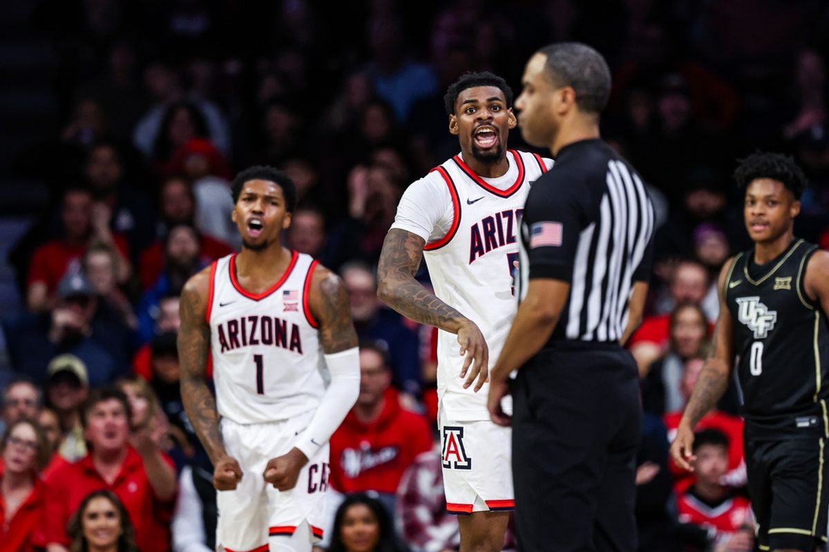 Jan 11, 2025; Tucson, Arizona, USA; Arizona Wildcats guard KJ Lewis (5) and guard Caleb Love (1) both yell toward the referee after a call was made during the second half of the game against the UCF Knights at McKale Center. Mandatory Credit: Aryanna Frank-Imagn Images