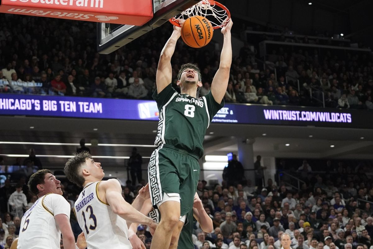 Jan 12, 2025; Evanston, Illinois, USA; Michigan State Spartans forward Frankie Fidler (8) dunks the ball on Northwestern Wildcats guard Brooks Barnhizer (13) during the first half at Welsh-Ryan Arena. Mandatory Credit: David Banks-Imagn Images