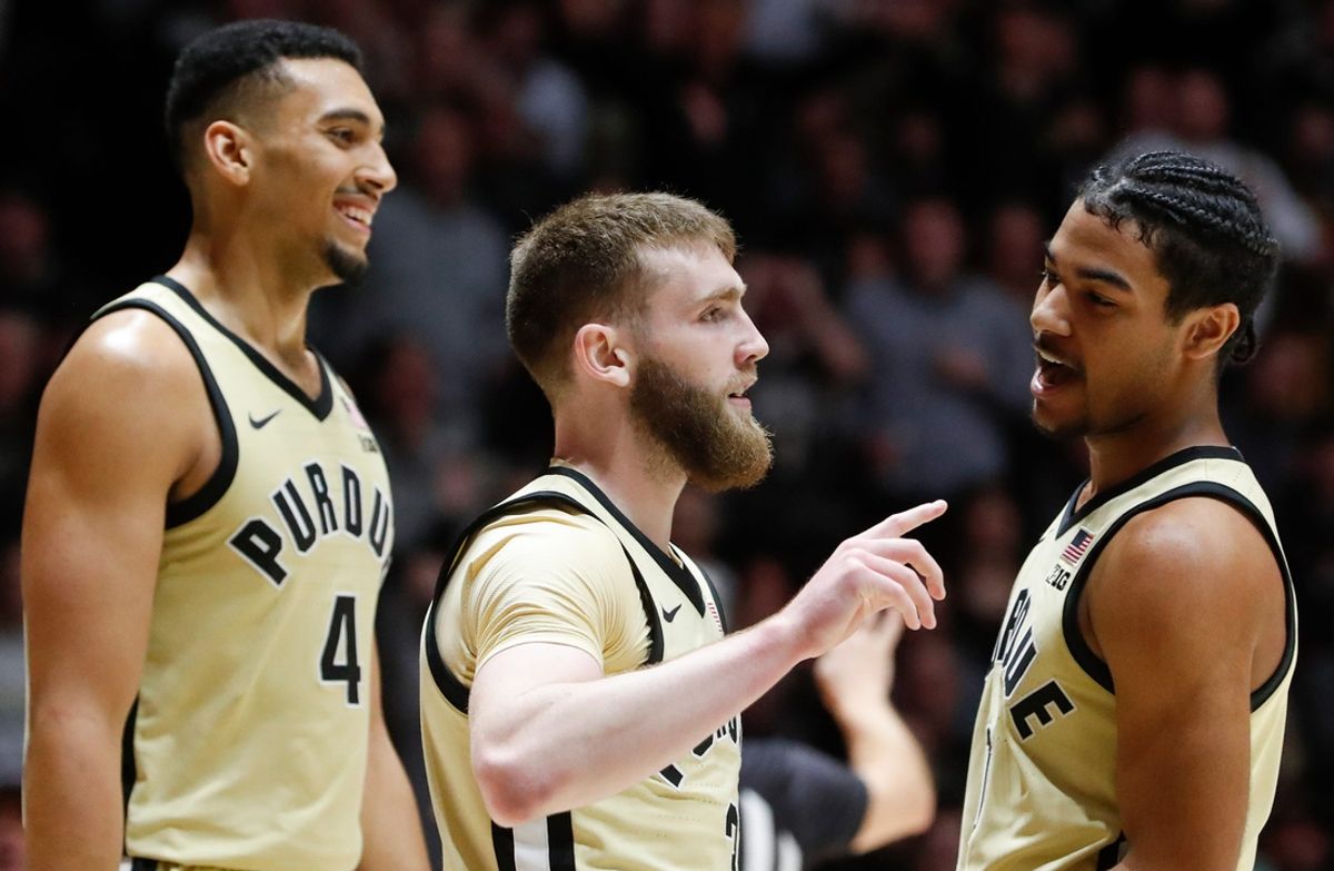Purdue Boilermakers forward Trey Kaufman-Renn (4), Purdue Boilermakers guard Braden Smith (3) and Purdue Boilermakers guard C.J. Cox (0) celebrate Sunday, Jan. 12, 2025, during the NCAA men’s basketball game against the Nebraska Cornhuskers at Mackey Arena in West Lafayette, Ind. Purdue Boilermakers won 104-68.
