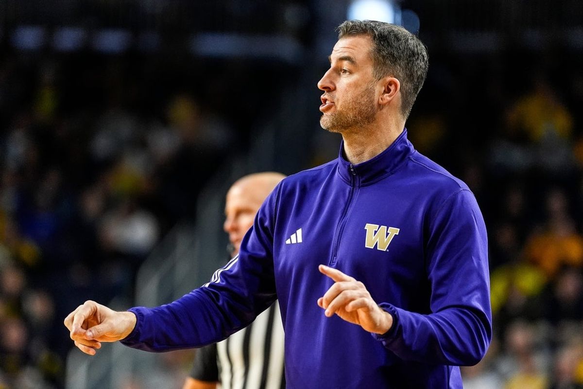 Washington head coach Danny Sprinkle reacts to a play against Washington during the first half at Crisler Center in Ann Arbor on Sunday, Jan. 12, 2025.