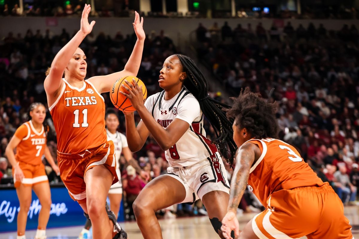 Jan 12, 2025; Columbia, South Carolina, USA; South Carolina Gamecocks forward Joyce Edwards (8) drives around Texas Longhorns forward Justice Carlton (11) in the first half at Colonial Life Arena. Mandatory Credit: Jeff Blake-Imagn Images