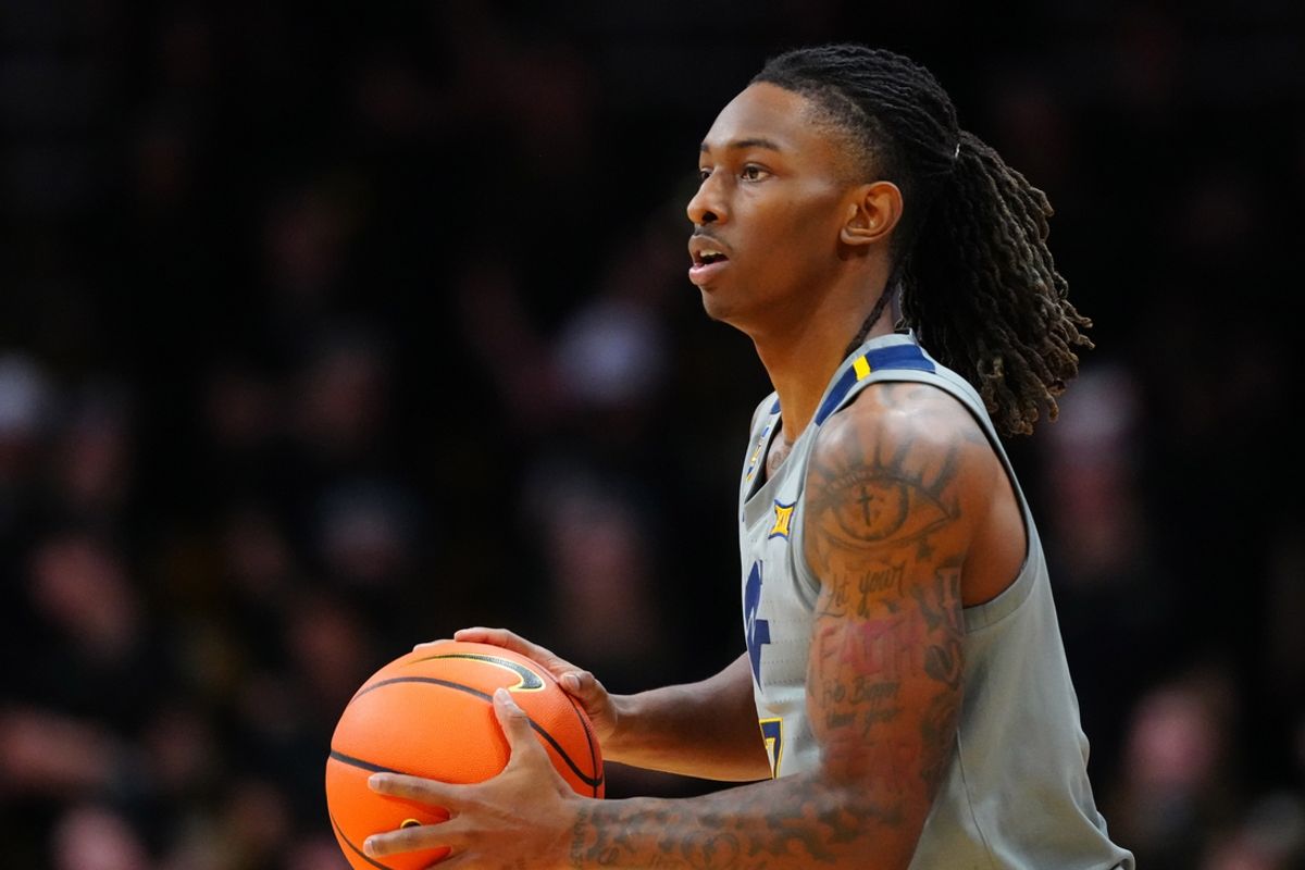 Jan 12, 2025; Boulder, Colorado, USA; West Virginia Mountaineers guard Javon Small (7) controls the ball in the first half against the Colorado Buffaloes at CU Events Center. Mandatory Credit: Ron Chenoy-Imagn Images