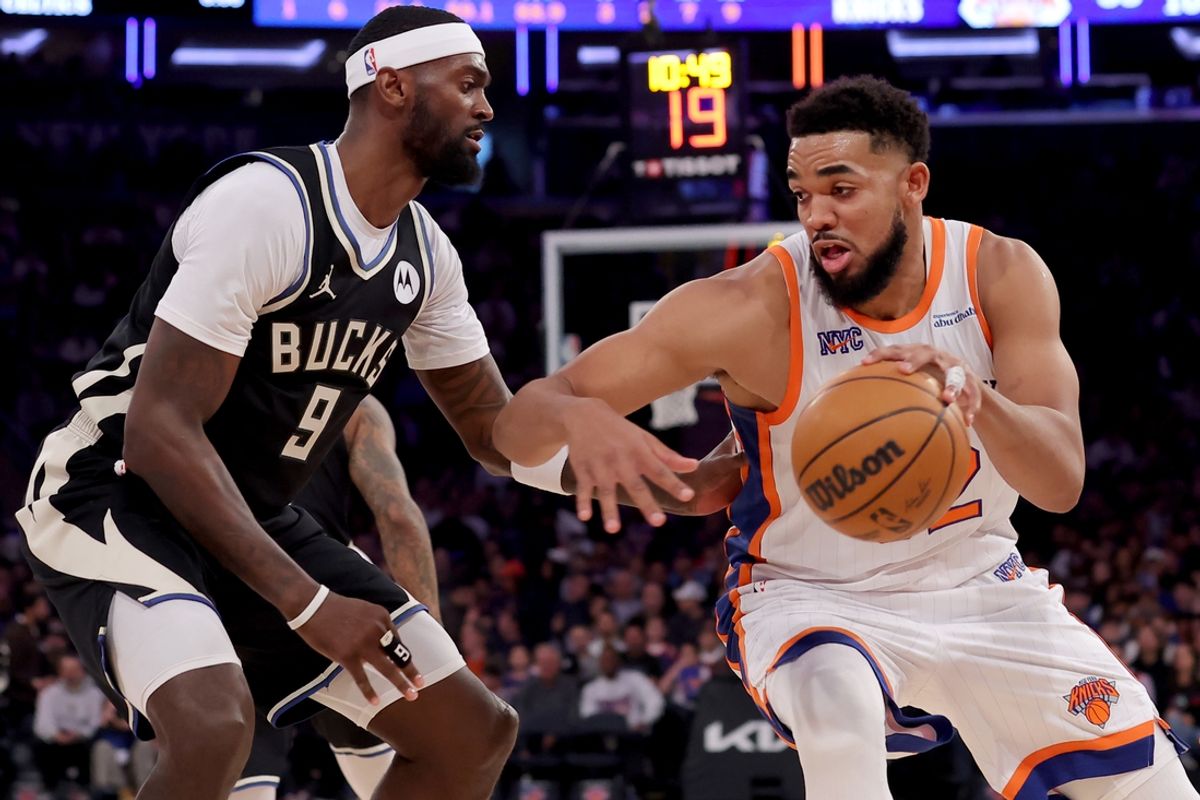 Jan 12, 2025; New York, New York, USA; New York Knicks center Karl-Anthony Towns (32) drives to the basket against Milwaukee Bucks forward Bobby Portis (9) during the second quarter at Madison Square Garden. Mandatory Credit: Brad Penner-Imagn Images