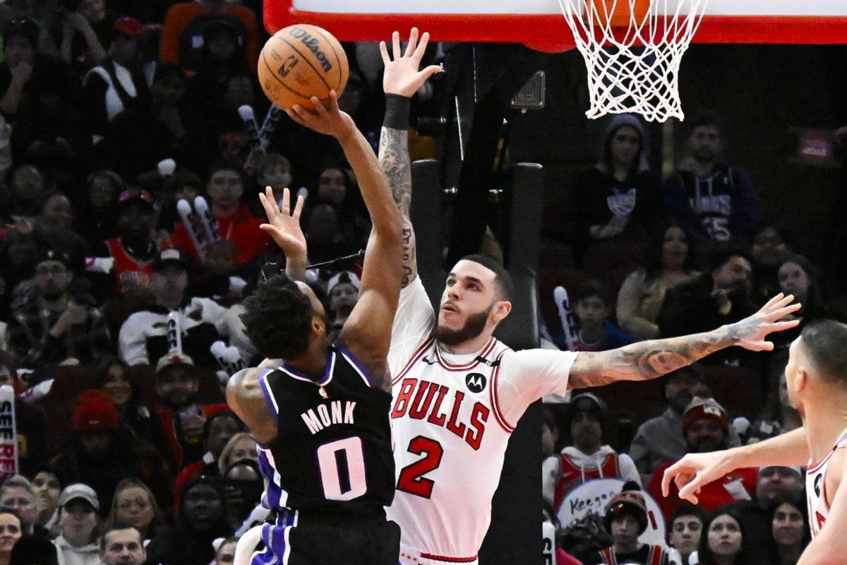 Jan 12, 2025; Chicago, Illinois, USA;  Chicago Bulls guard Lonzo Ball (2) defend against Sacramento Kings guard Malik Monk (0) during the first half at United Center. Mandatory Credit: Matt Marton-Imagn Images