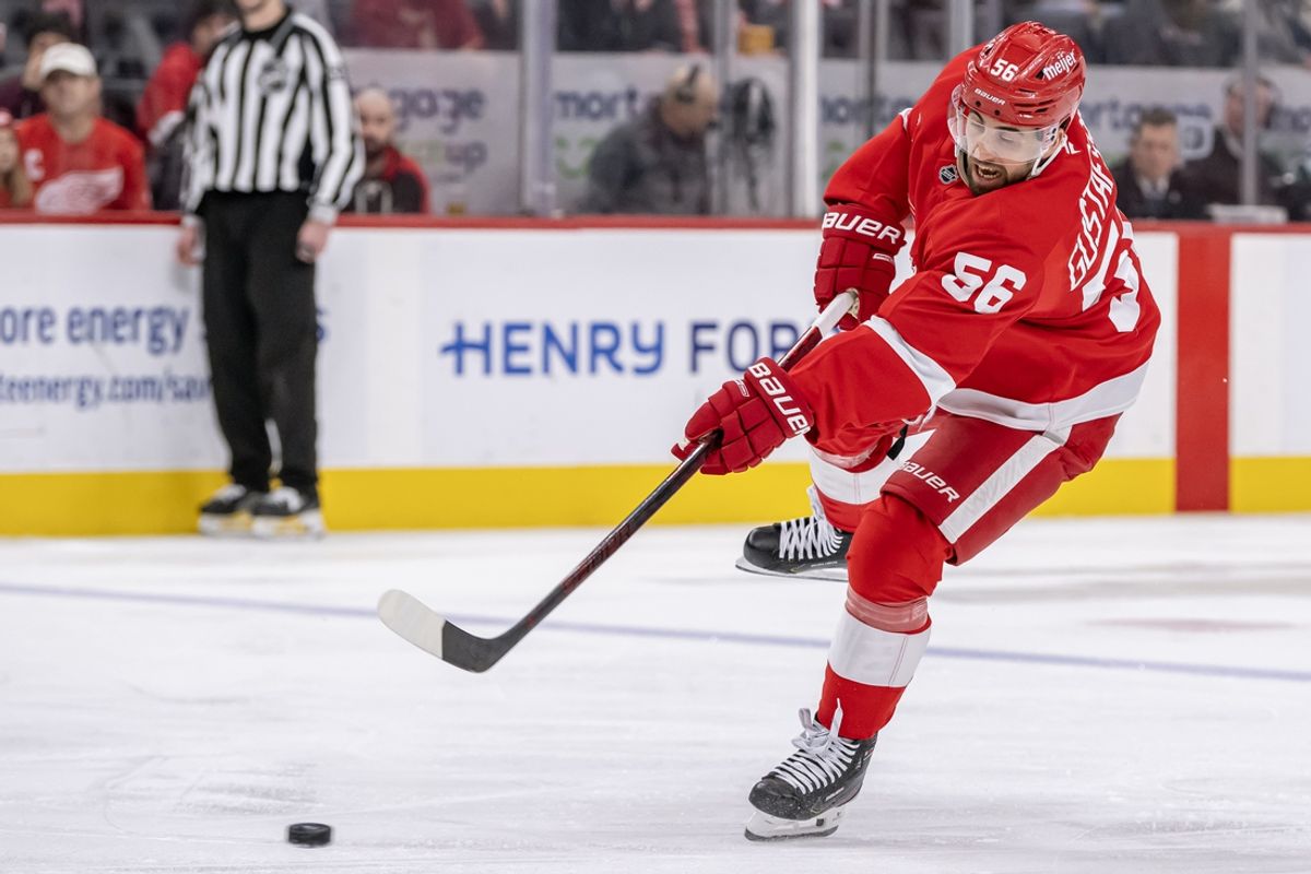 Jan 12, 2025; Detroit, Michigan, USA;  Detroit Red Wings defenseman Erik Gustafsson (56) scores a power play goal against the Seattle Kraken during the second period at Little Caesars Arena. Mandatory Credit: Nick Wosika-Imagn Images