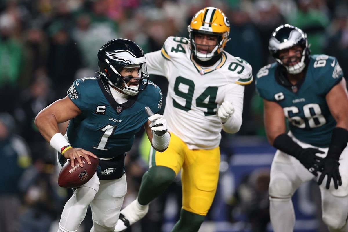 Jan 12, 2025; Philadelphia, Pennsylvania, USA; Philadelphia Eagles quarterback Jalen Hurts (1) drops back to pass against the Green Bay Packers during the first half in an NFC wild card game at Lincoln Financial Field. Mandatory Credit: Bill Streicher-Imagn Images