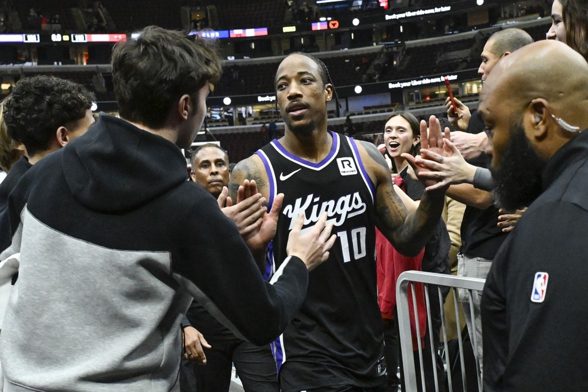 Jan 12, 2025; Chicago, Illinois, USA;   Sacramento Kings forward DeMar DeRozan (10) high fives fans after the game against the Chicago Bulls during the second half at United Center. Mandatory Credit: Matt Marton-Imagn Images