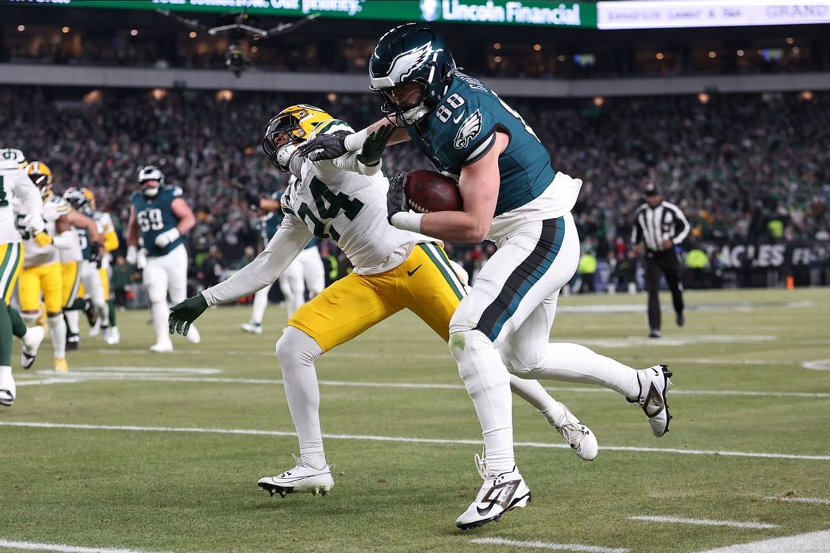 Jan 12, 2025; Philadelphia, Pennsylvania, USA; Philadelphia Eagles tight end Dallas Goedert (88) makes a catch against Green Bay Packers cornerback Carrington Valentine (24) during the third quarter in an NFC wild card game at Lincoln Financial Field. Mandatory Credit: Bill Streicher-Imagn Images