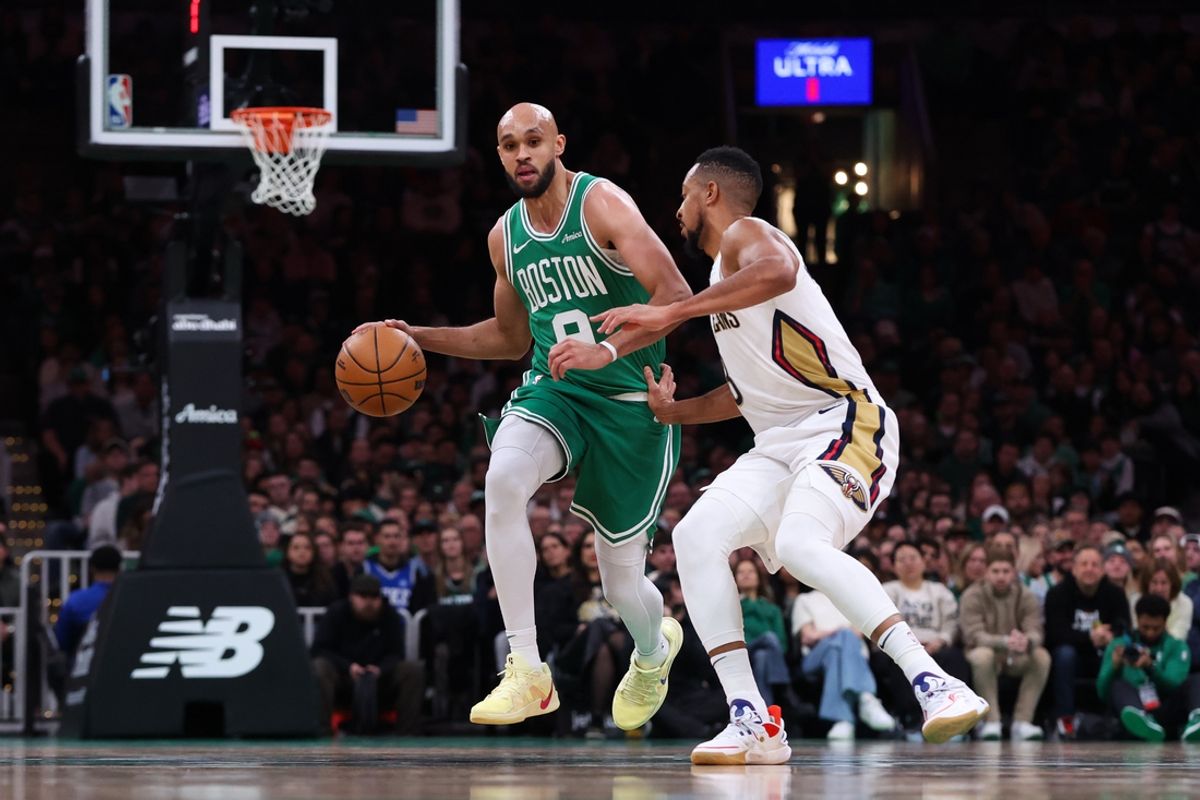Jan 12, 2025; Boston, Massachusetts, USA; Boston Celtics guard Derrick White (9) dribbles down the court during the first half against the New Orleans Pelicans at TD Garden. Mandatory Credit: Paul Rutherford-Imagn Images