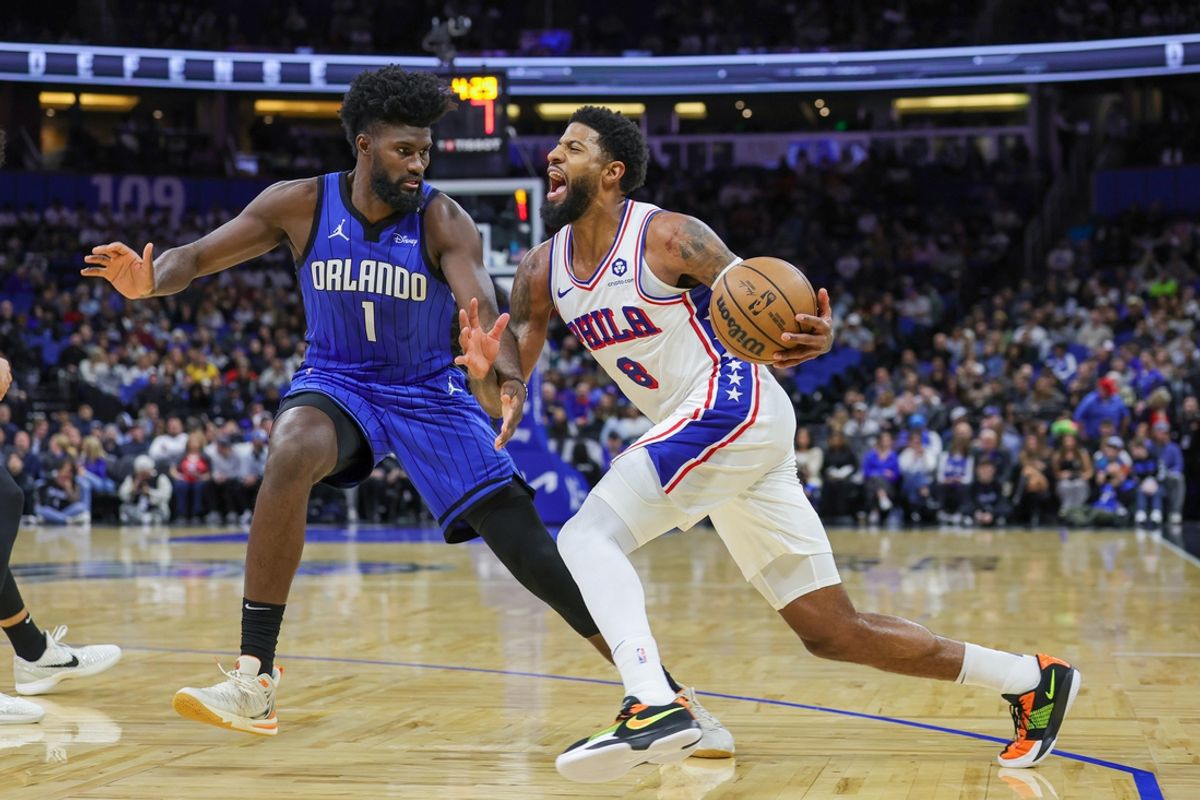Jan 12, 2025; Orlando, Florida, USA; Philadelphia 76ers forward Paul George (8) is fouled by Orlando Magic forward Jonathan Isaac (1) during the second quarter at Kia Center. Mandatory Credit: Mike Watters-Imagn Images