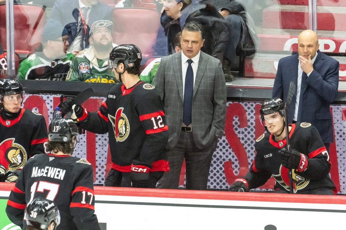 Jan 12, 2025; Ottawa, Ontario, CAN; Ottawa Senators head coach Travis Green speaks to his team in the third period against the Dallas Stars at the Canadian Tire Centre. Mandatory Credit: Marc DesRosiers-Imagn Images