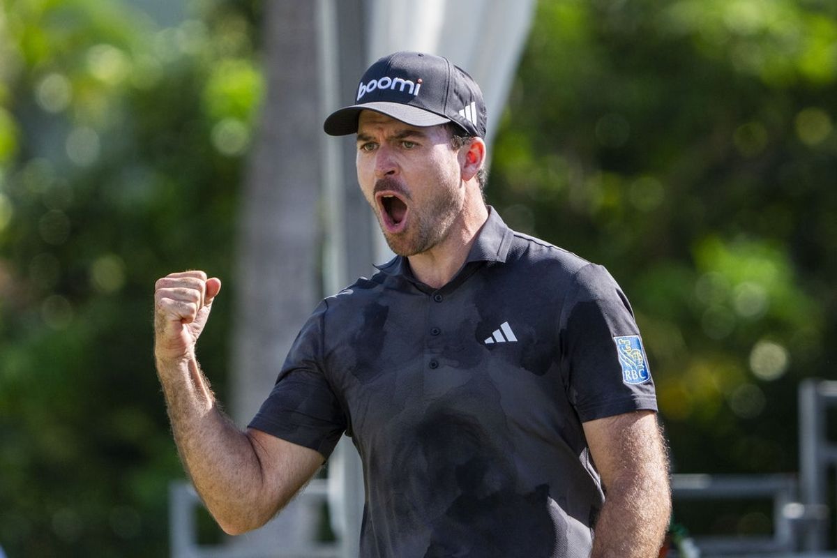 January 12, 2025; Honolulu, Hawaii, USA; Nick Taylor celebrates after making an eagle on the 18th hole during the final round of the Sony Open golf tournament at Waialae Country Club. Mandatory Credit: Kyle Terada-Imagn Images