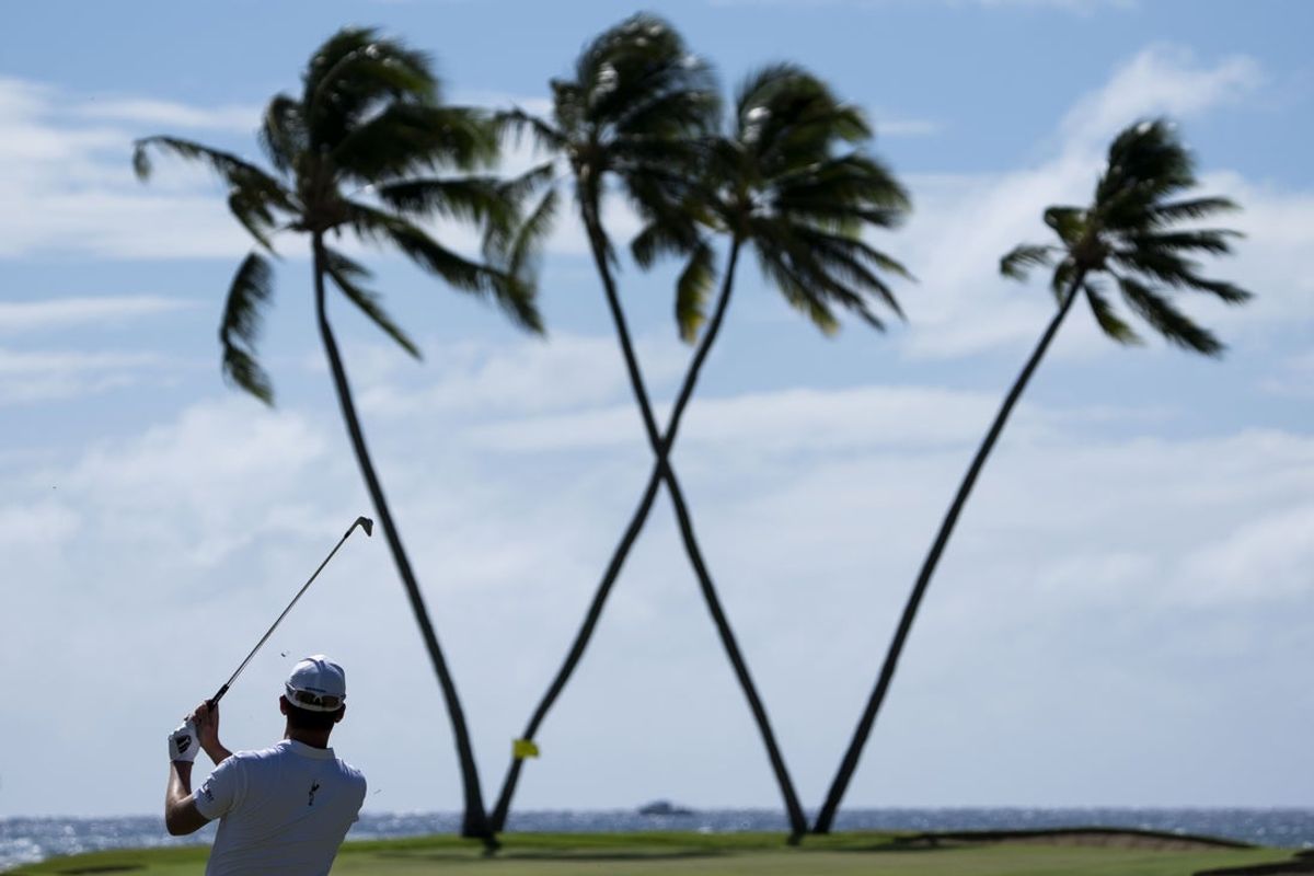 January 12, 2025; Honolulu, Hawaii, USA; Andrew Putnam hits his second shot on the 16th hole during the final round of the Sony Open golf tournament at Waialae Country Club. Mandatory Credit: Kyle Terada-Imagn Images