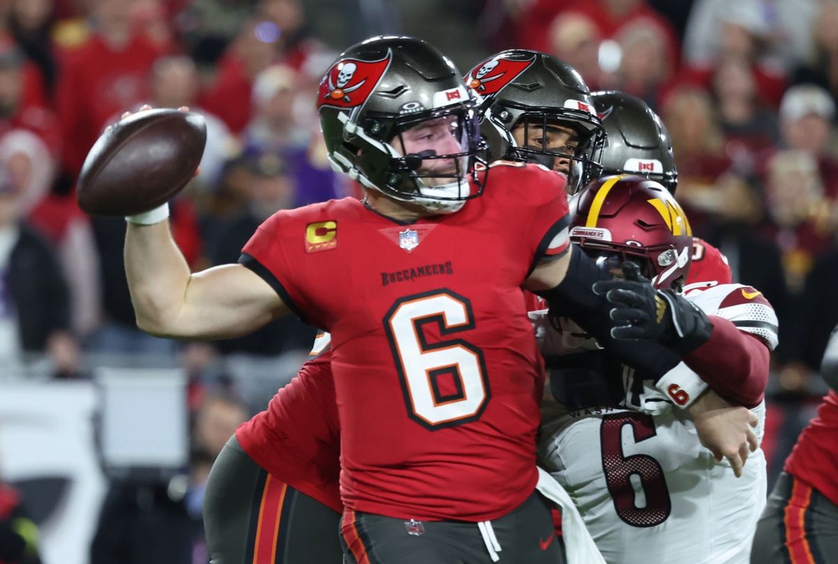 Jan 12, 2025; Tampa, Florida, USA; Tampa Bay Buccaneers quarterback Baker Mayfield (6) throws against Washington Commanders linebacker Dante Fowler Jr. (6) during the second quarter of a NFC wild card playoff at Raymond James Stadium. Mandatory Credit: Kim Klement Neitzel-Imagn Images