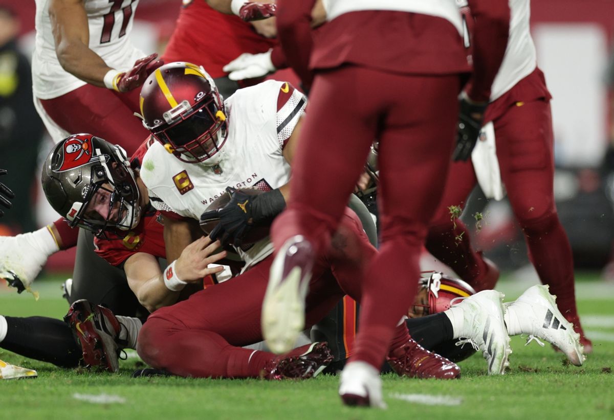 Jan 12, 2025; Tampa, Florida, USA; Washington Commanders linebacker Bobby Wagner (54) recovers a fumble by Tampa Bay Buccaneers quarterback Baker Mayfield (6) during the fourth quarter of a NFC wild card playoff at Raymond James Stadium. Mandatory Credit: Nathan Ray Seebeck-Imagn Images