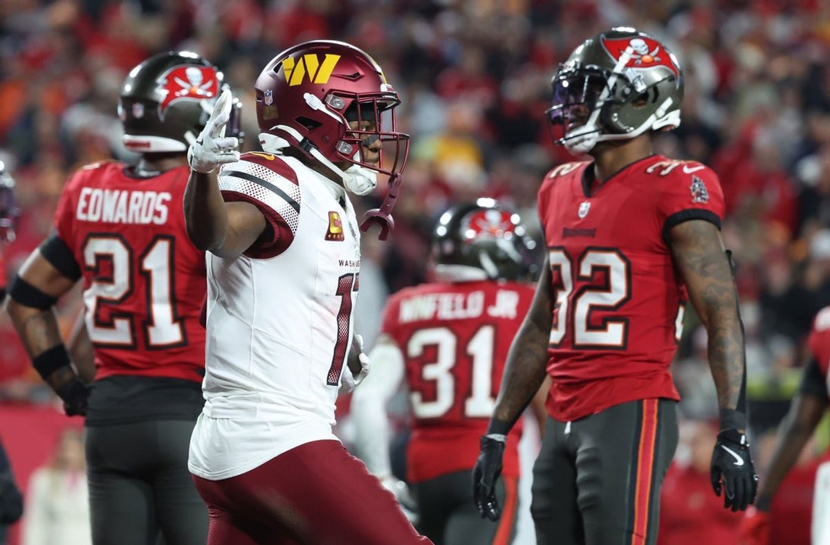 Jan 12, 2025; Tampa, Florida, USA; Washington Commanders wide receiver Terry McLaurin (17) reacts after catching a touchdown during the fourth quarter of a NFC wild card playoff against the Tampa Bay Buccaneers at Raymond James Stadium. Mandatory Credit: Kim Klement Neitzel-Imagn Images