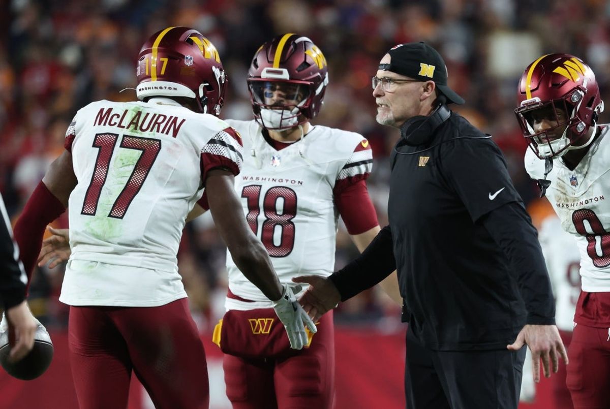 Jan 12, 2025; Tampa, Florida, USA; Washington Commanders wide receiver Terry McLaurin (17) celebrates with head coach Dan Quinn after catching a touchdown during the fourth quarter of a NFC wild card playoff against the Tampa Bay Buccaneers at Raymond James Stadium. Mandatory Credit: Kim Klement Neitzel-Imagn Images