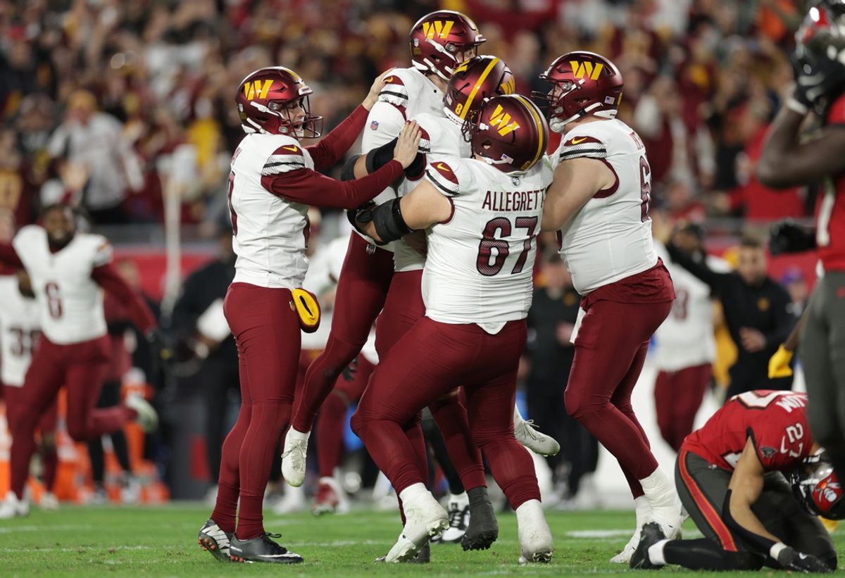 Jan 12, 2025; Tampa, Florida, USA; Washington Commanders place kicker Zane Gonzalez (47) celebrates with teammates after kicking the game-wining field goal during the fourth quarter of a NFC wild card playoff against the Tampa Bay Buccaneers at Raymond James Stadium. Mandatory Credit: Nathan Ray Seebeck-Imagn Images