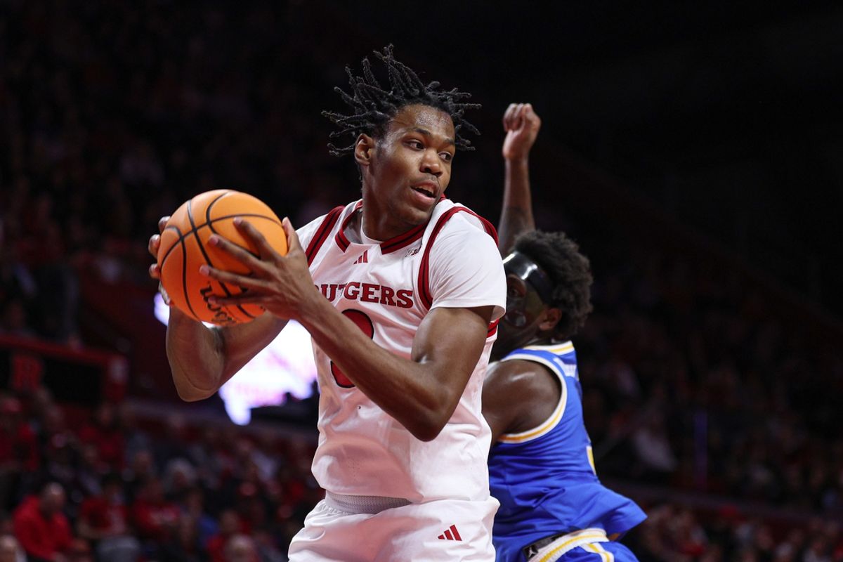Jan 13, 2025; Piscataway, New Jersey, USA; Rutgers Scarlet Knights forward Dylan Grant (9) rebounds during the first half against UCLA Bruins guard Eric Dailey Jr. (3) at Jersey Mike's Arena. Mandatory Credit: Vincent Carchietta-Imagn Images