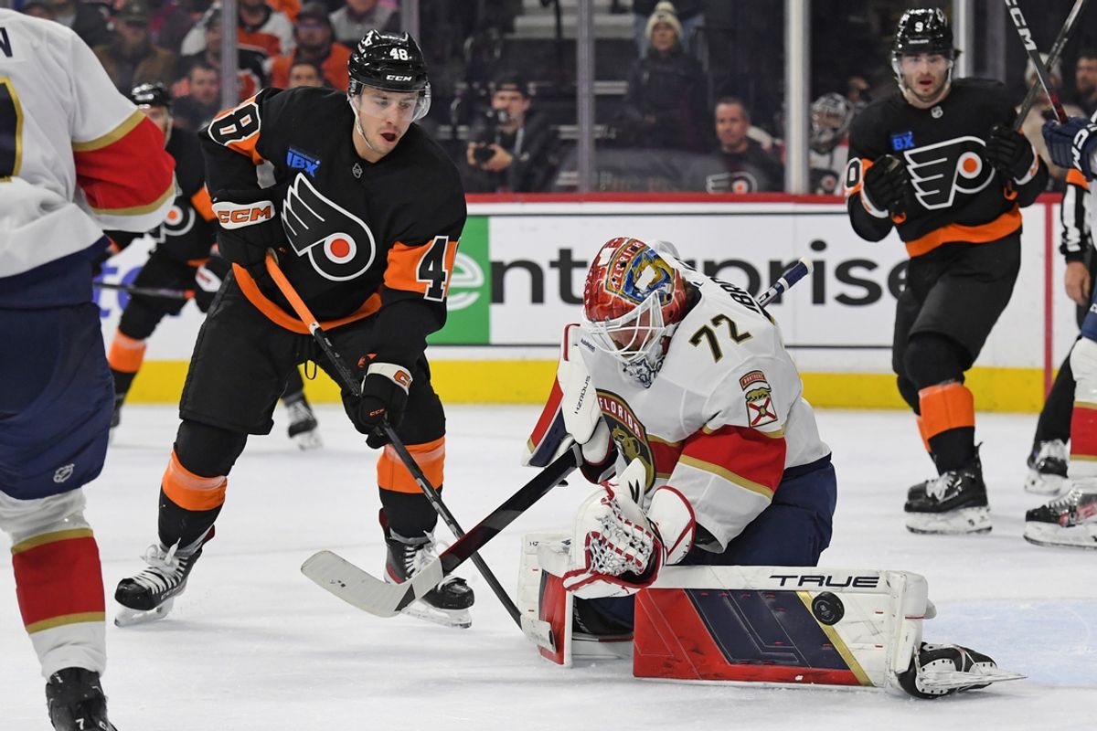 Jan 13, 2025; Philadelphia, Pennsylvania, USA; Florida Panthers goaltender Sergei Bobrovsky (72) makes a save as Philadelphia Flyers center Morgan Frost (48) stands by during the first period at Wells Fargo Center. Mandatory Credit: Eric Hartline-Imagn Images