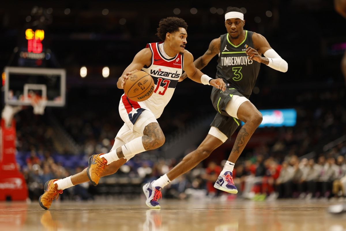 Jan 13, 2025; Washington, District of Columbia, USA; Washington Wizards guard Jordan Poole (13) drives to the basket as Minnesota Timberwolves forward Jaden McDaniels (3) defends in the second quarter at Capital One Arena. Mandatory Credit: Geoff Burke-Imagn Images