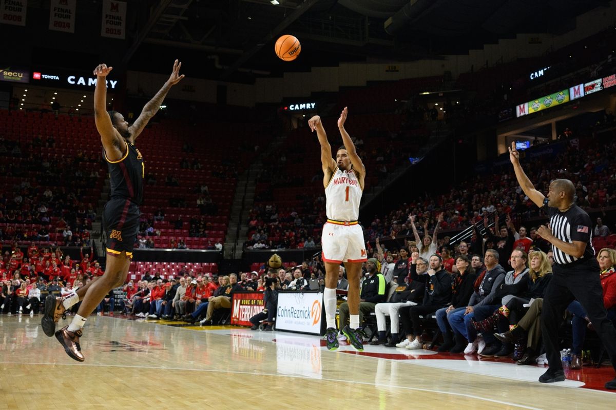 Jan 13, 2025; College Park, Maryland, USA; Maryland Terrapins guard Rodney Rice (1) takes a three point shot over Minnesota Golden Gophers guard Femi Odukale (11) during the second half at Xfinity Center. Mandatory Credit: Reggie Hildred-Imagn Images
