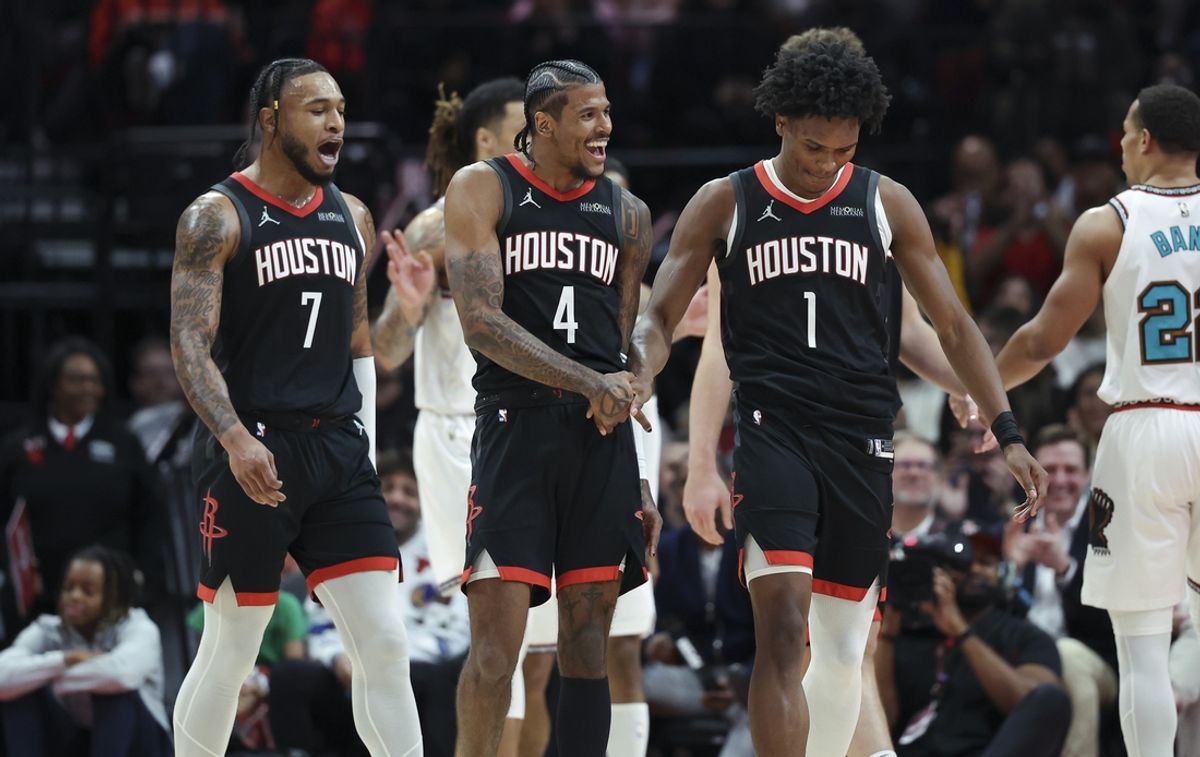 Jan 13, 2025; Houston, Texas, USA; Houston Rockets guard Jalen Green (4) celebrates with forward Amen Thompson (1) after scoring a basket during the second quarter against the Memphis Grizzlies at Toyota Center. Mandatory Credit: Troy Taormina-Imagn Images