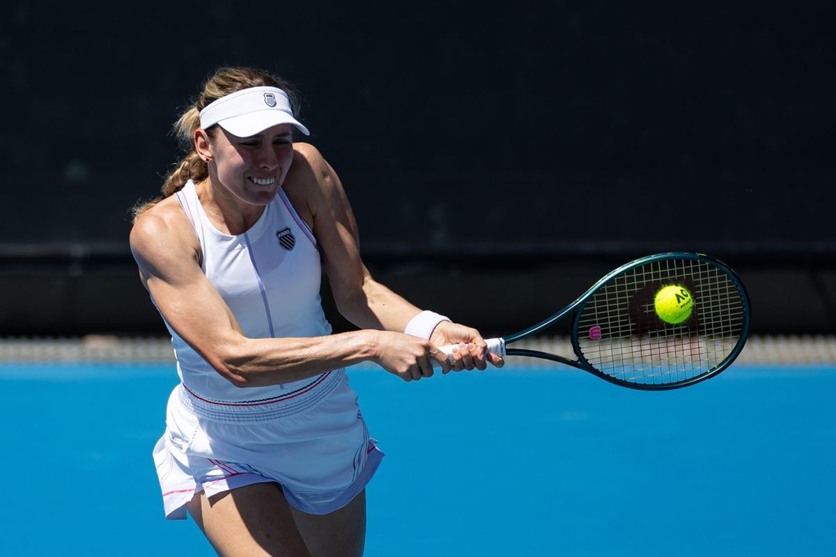 Jan 14, 2025; Melbourne, Victoria, Australia; Ekaterina Alexandrova plays a backhand during her match against Emma Raducanu of United Kingdom in the first round of the women's singles at the 2025 Australian Open at Melbourne Park. Mandatory Credit: Mike Frey-Imagn Images