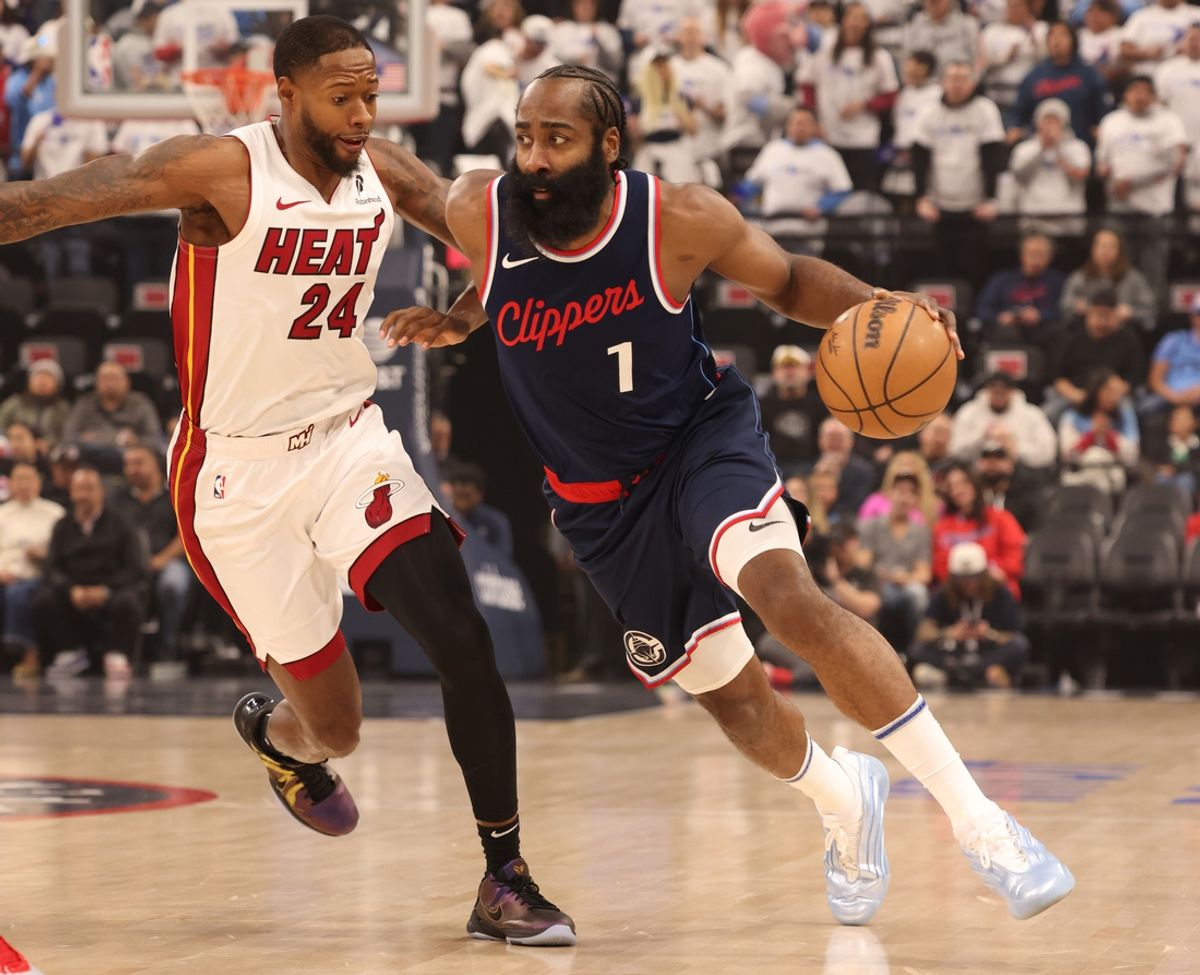 Jan 13, 2025; Inglewood, California, USA; LA Clippers guard James Harden (1) drives against Miami Heat forward Haywood Highsmith (24) during the first quarter at Intuit Dome. Mandatory Credit: Jason Parkhurst-Imagn Images