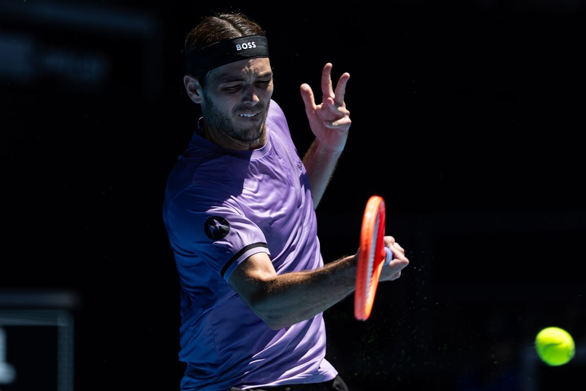 Jan 14, 2025; Melbourne, Victoria, Australia; Taylor Fritz of United States of America hits a forehand during his match against Jenson Brooksby of United States of America in the first round of the men's singles at the 2025 Australian Open at Melbourne Park. Mandatory Credit: Mike Frey-Imagn Images